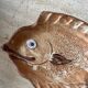 Decorative ceramic plate in the shape of a fish from the 1970s.