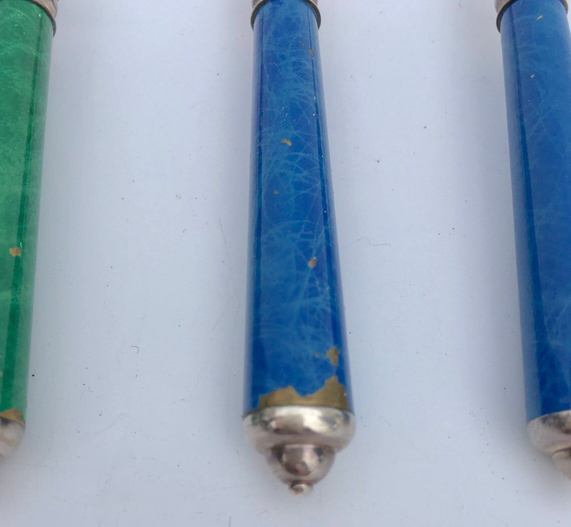 Set of eight enamelled silver spoons