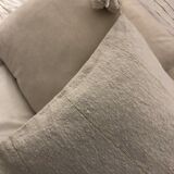 White cushion cover with pom poms