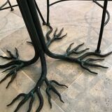 Wrought iron table with tree sculpture and glass top