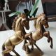 of greenhouse art deco bookends recancing unicorns. solid brass