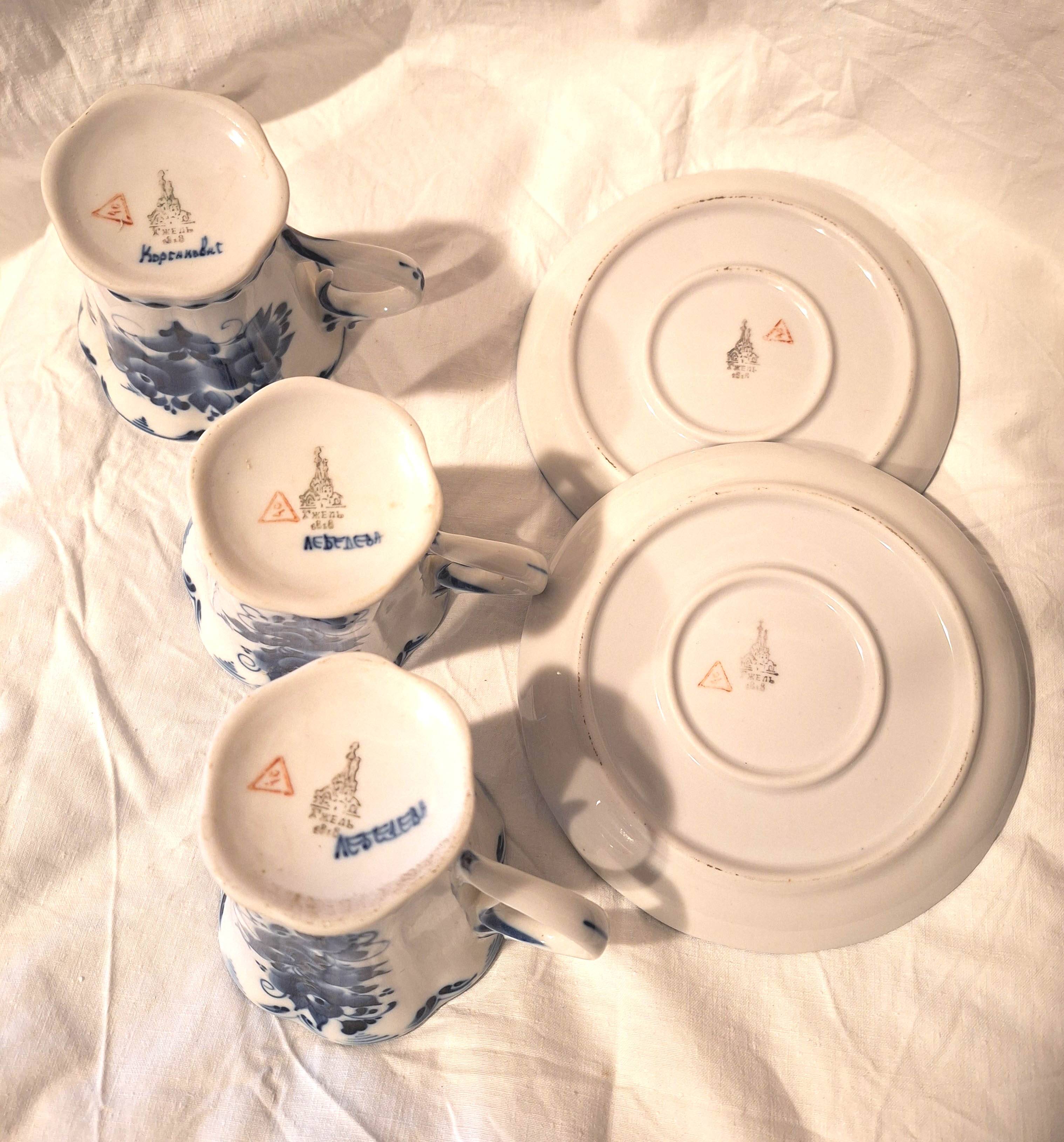 Three cups and two saucers made of Gzhel porcelain.