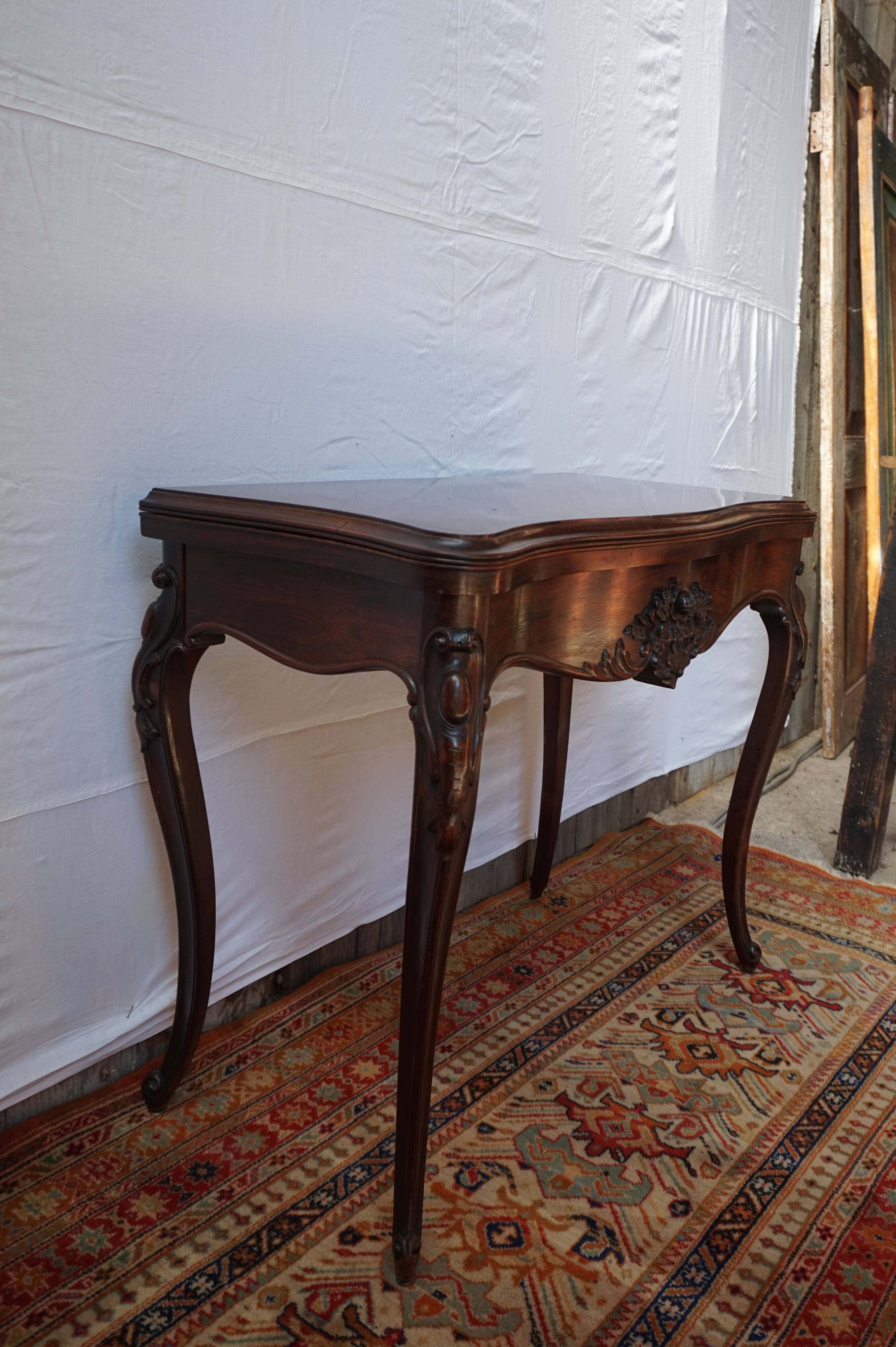 A XIX rosewood games table