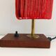 Lamp in wood, brass and wool