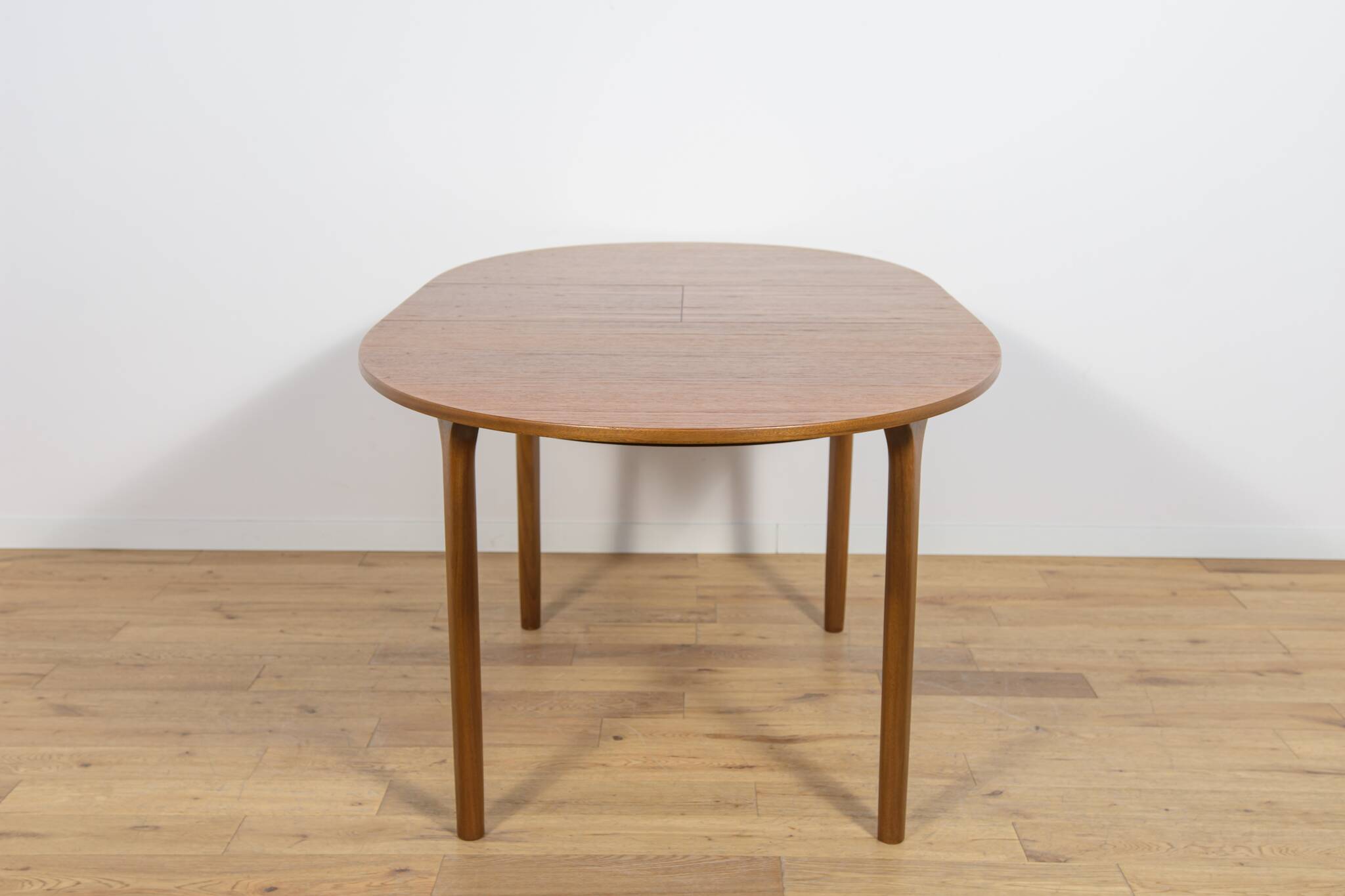 Mid-century extendable oval teak dining table from McIntosh, UK