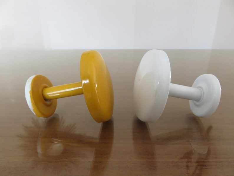 2 wall mounted coat racks in yellow and white metal 70s 80s
