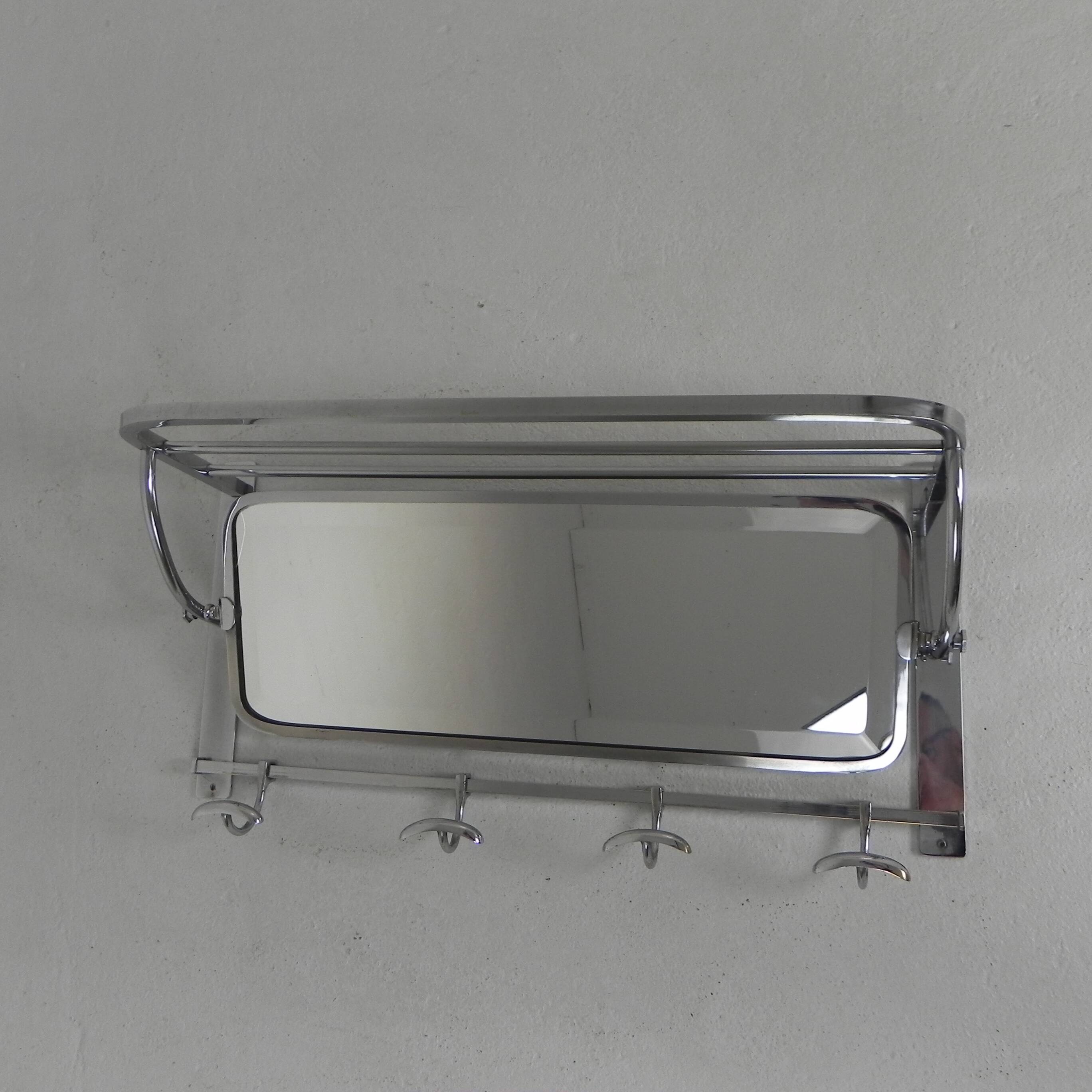 Art Deco wall coat rack with a bevelled mirror adjustable in a chrome frame, 1930s.