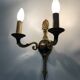 Pair of wall sconces in the Empire style with double lights in bronze.