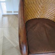 Woven rattan armchair and exotic wood in colonial style, 1980s.