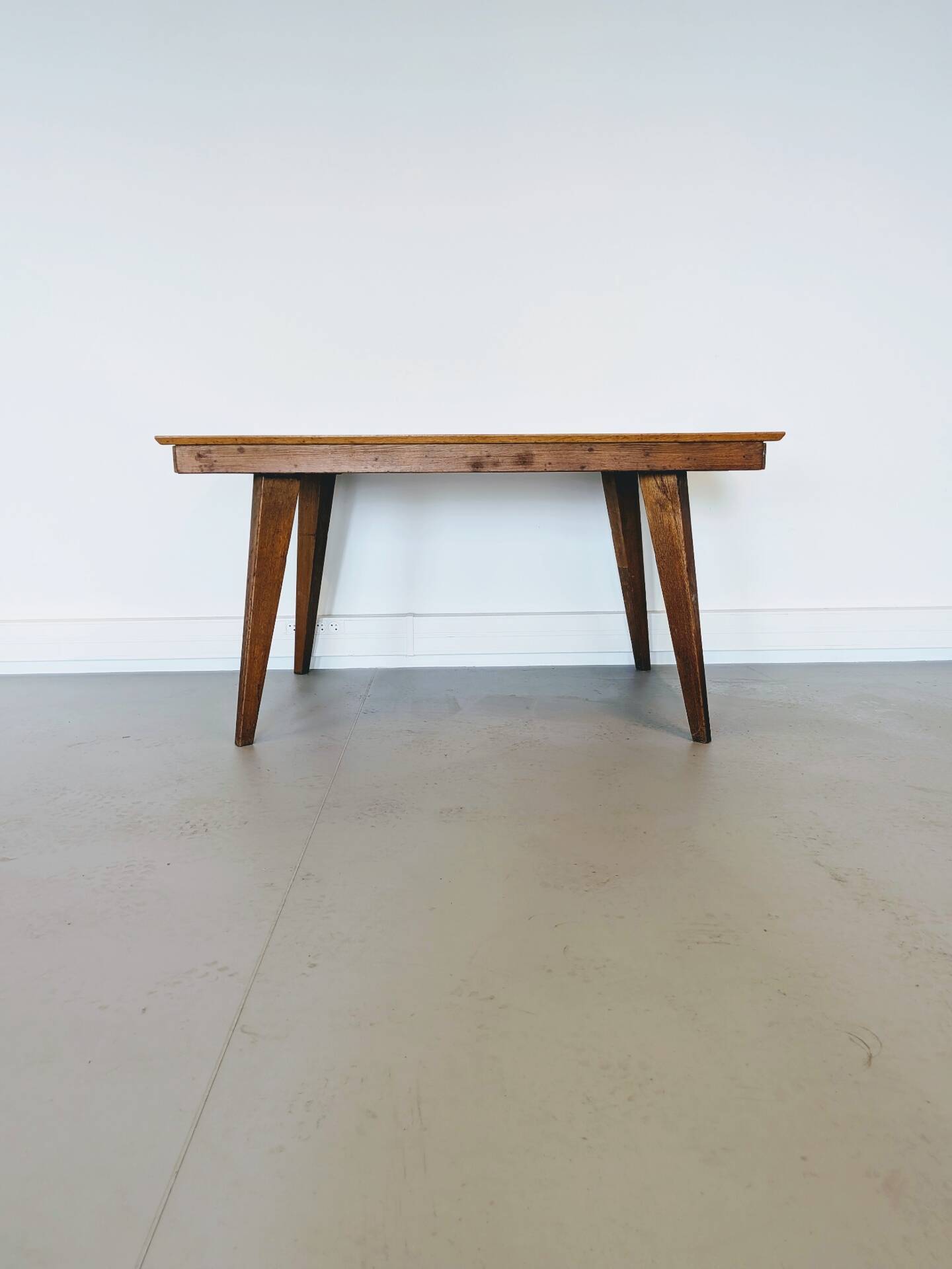 Vintage Scandinavian wooden dining table with tapered legs.