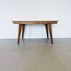 Vintage Scandinavian wooden dining table with tapered legs.