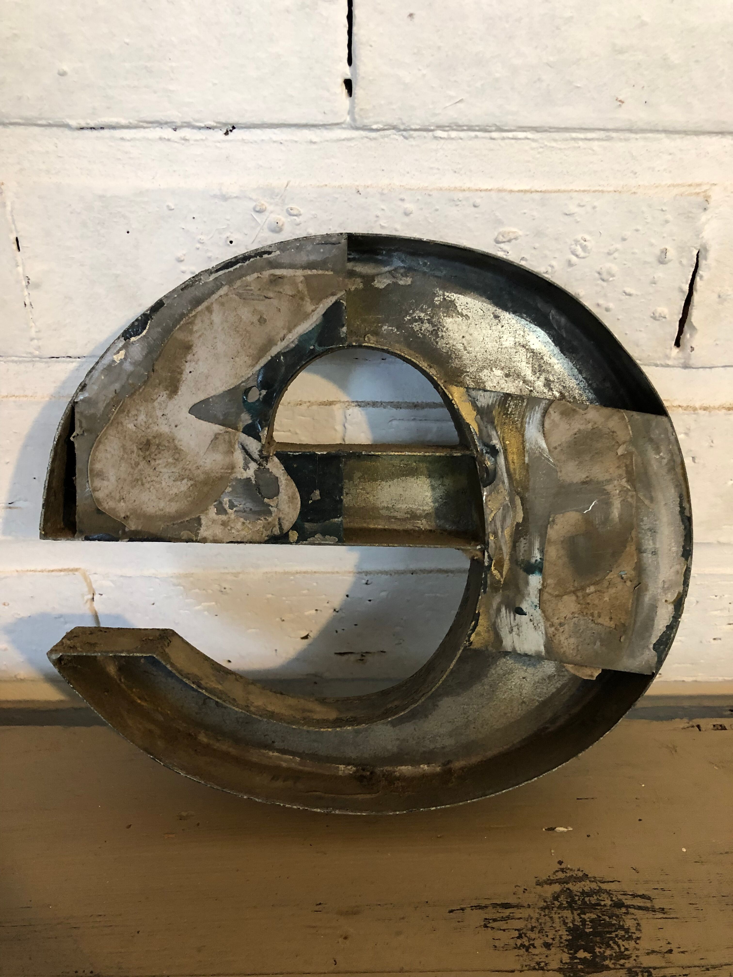 Blue sign letter "E"