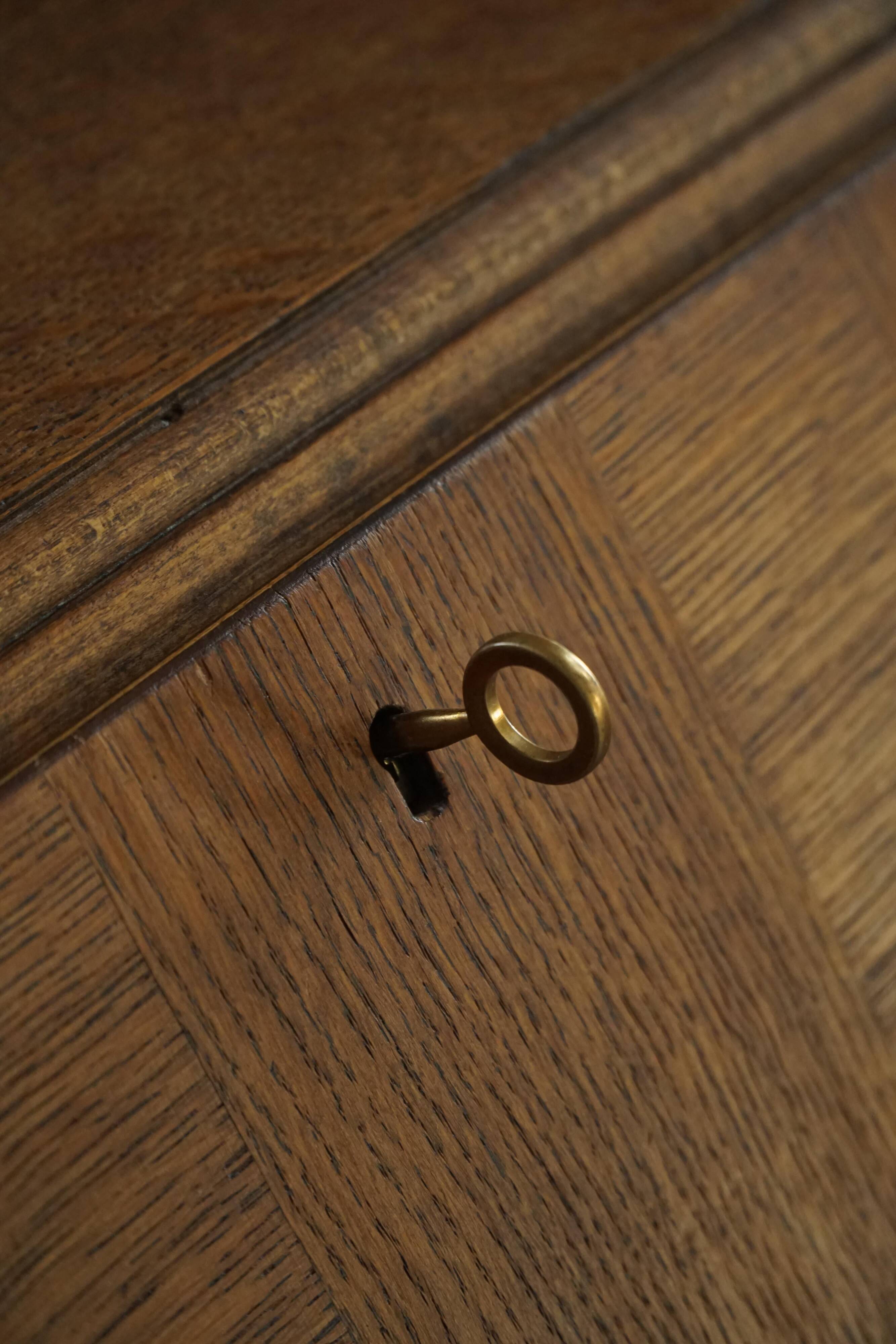 Desk / Chest of drawers in modern Danish oak from the early 20th century with shell handles.