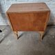 Small vintage Art Deco piece with 3 drawers, curved legs and caps.