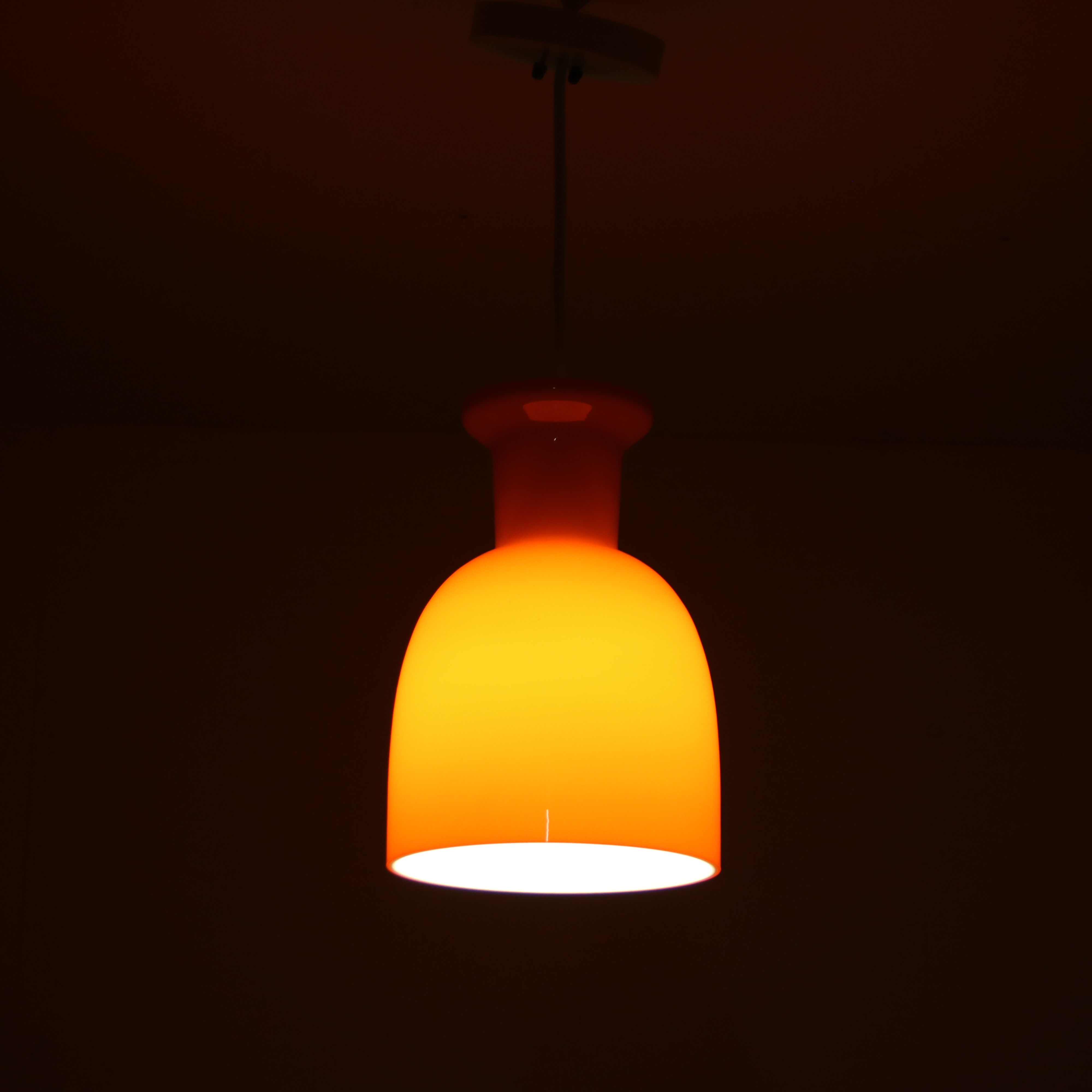 Pair of orange hanging lamps by Raak, the Netherlands, 1970