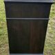 Blackened wooden chest of drawers with 5 drawers
