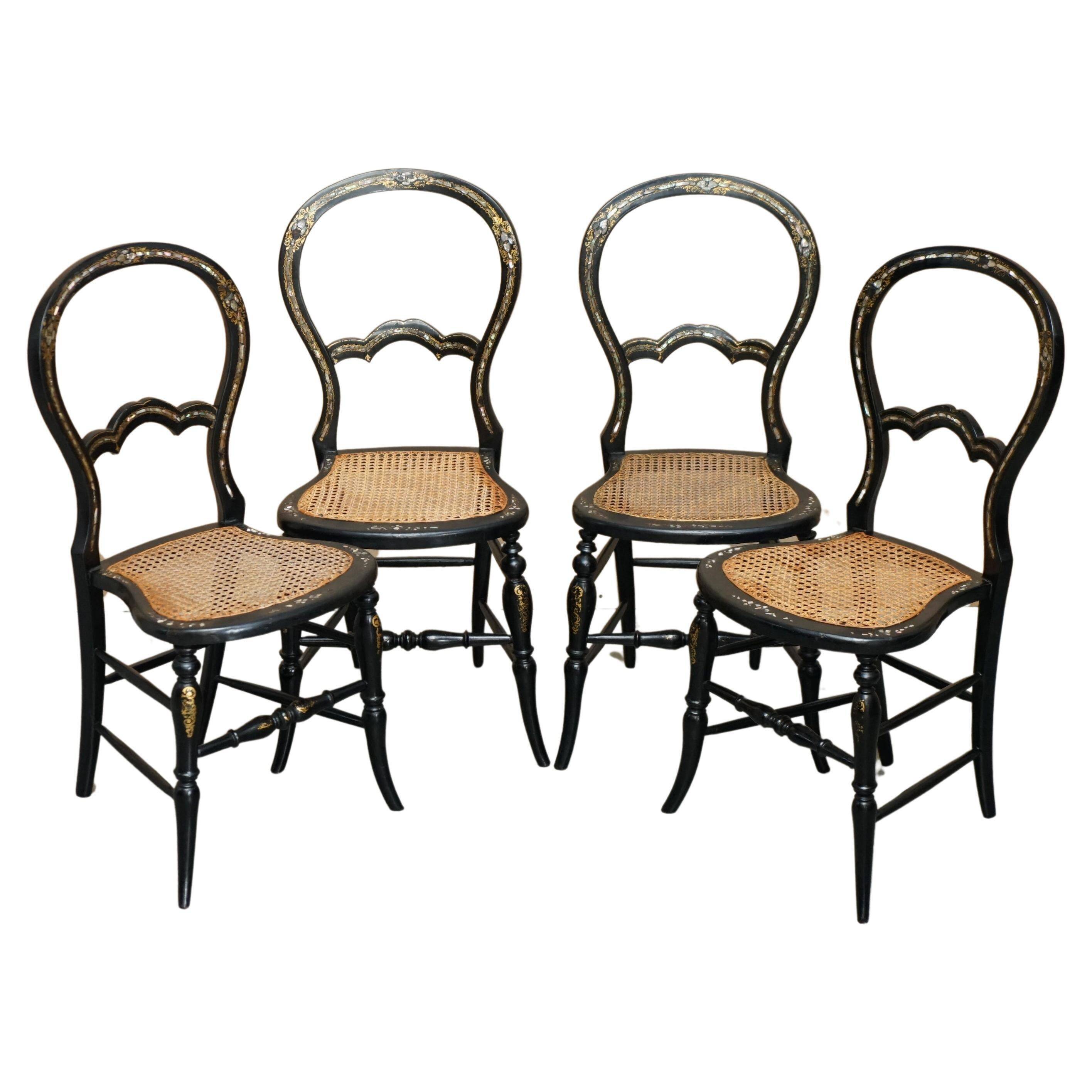 Four antique Regency bergère chairs with mother-of-pearl inlay.