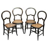 Four antique Regency bergère chairs with mother-of-pearl inlay.