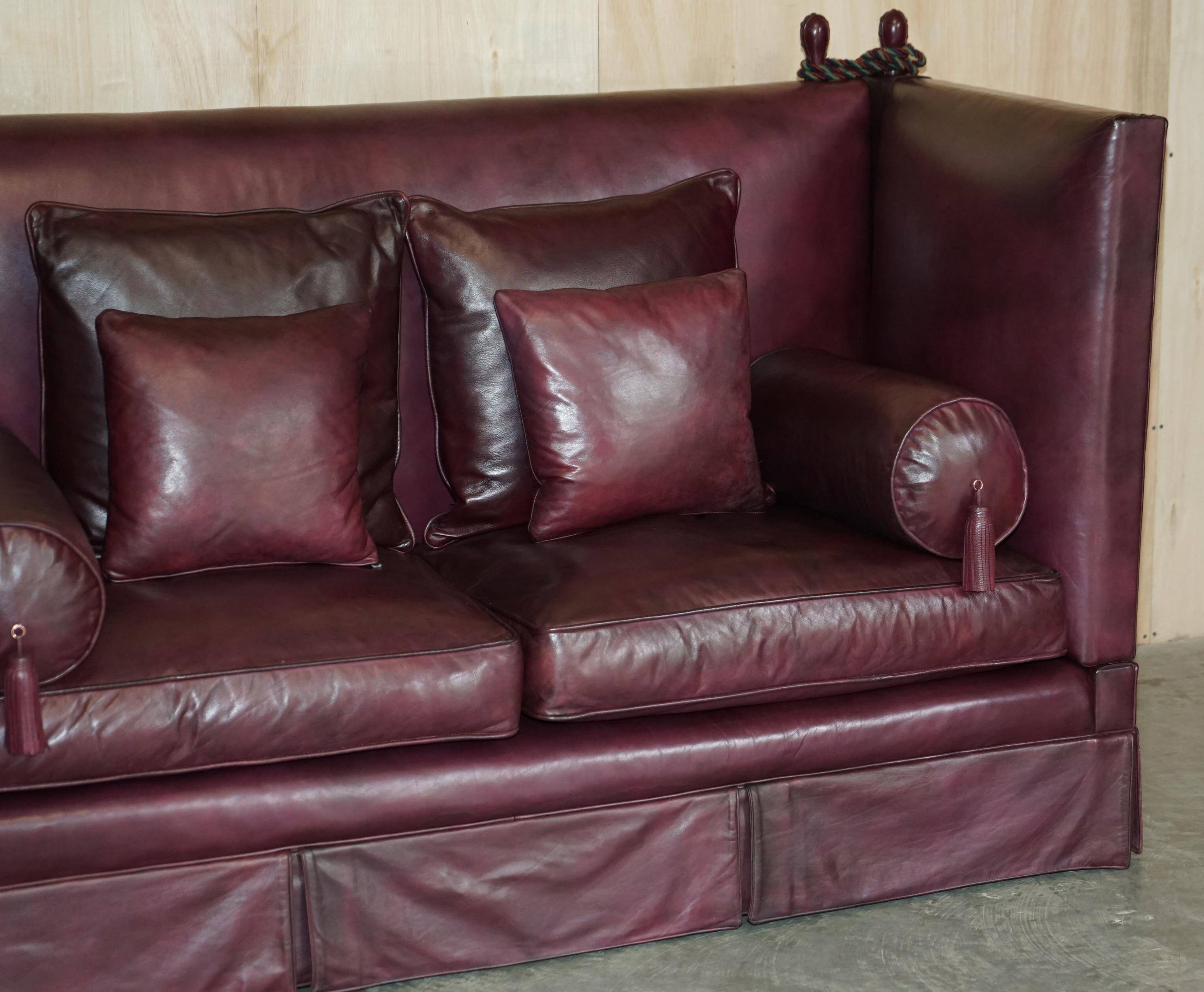 Victorian Knole canapé restored in leather with feather cushions.