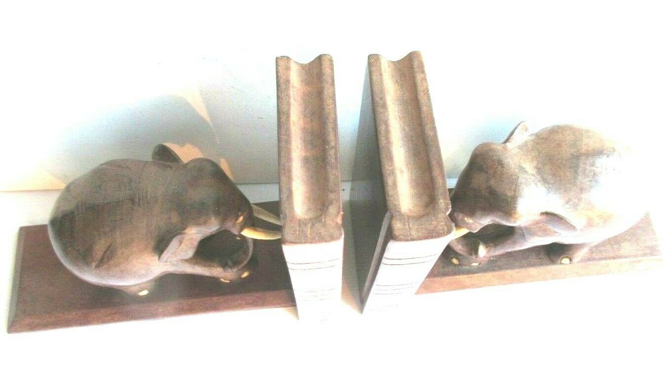 Art Deco bookends wooden elephants and bones on wooden terrace, book shape