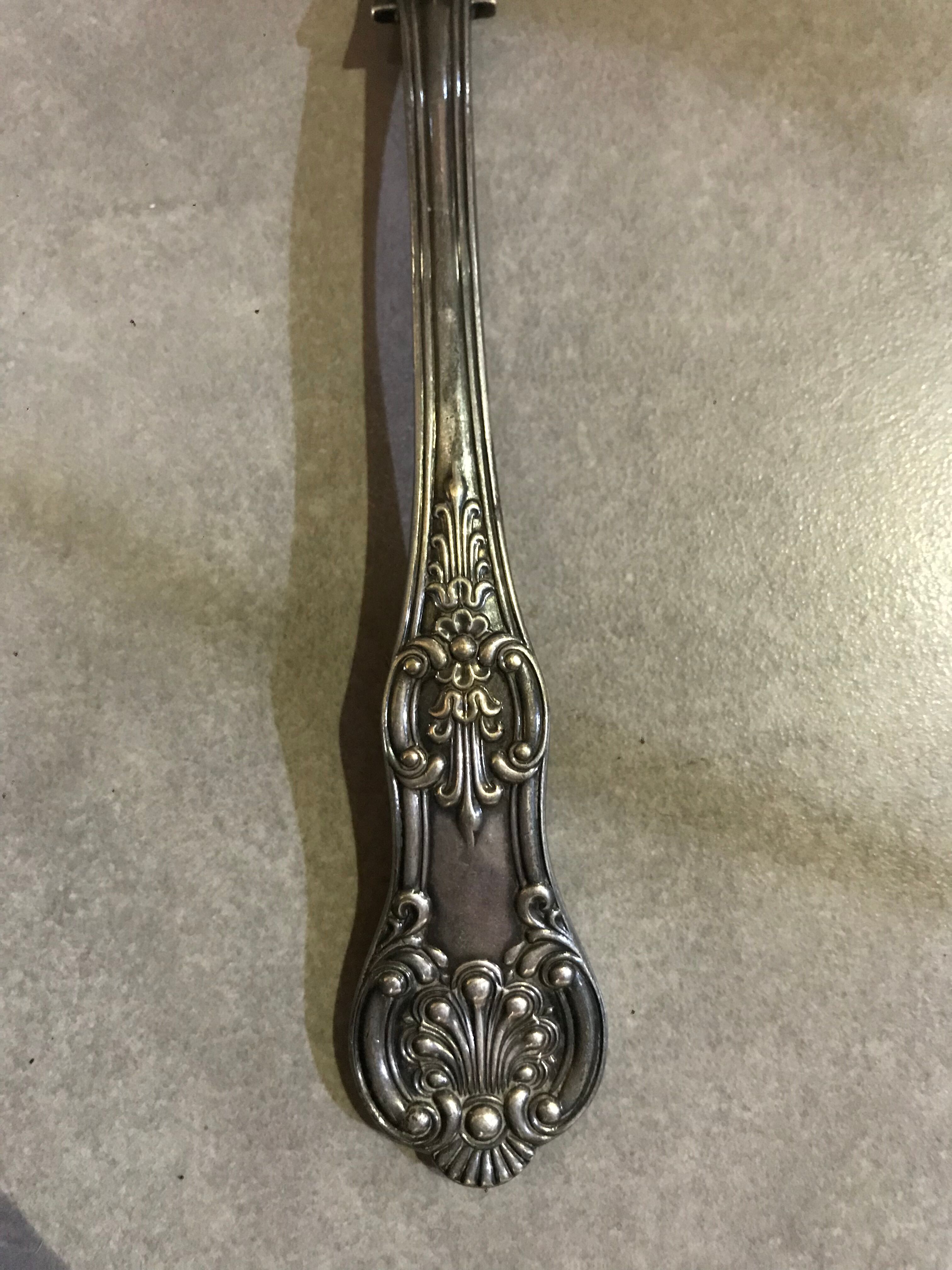 Small silver metal ladle