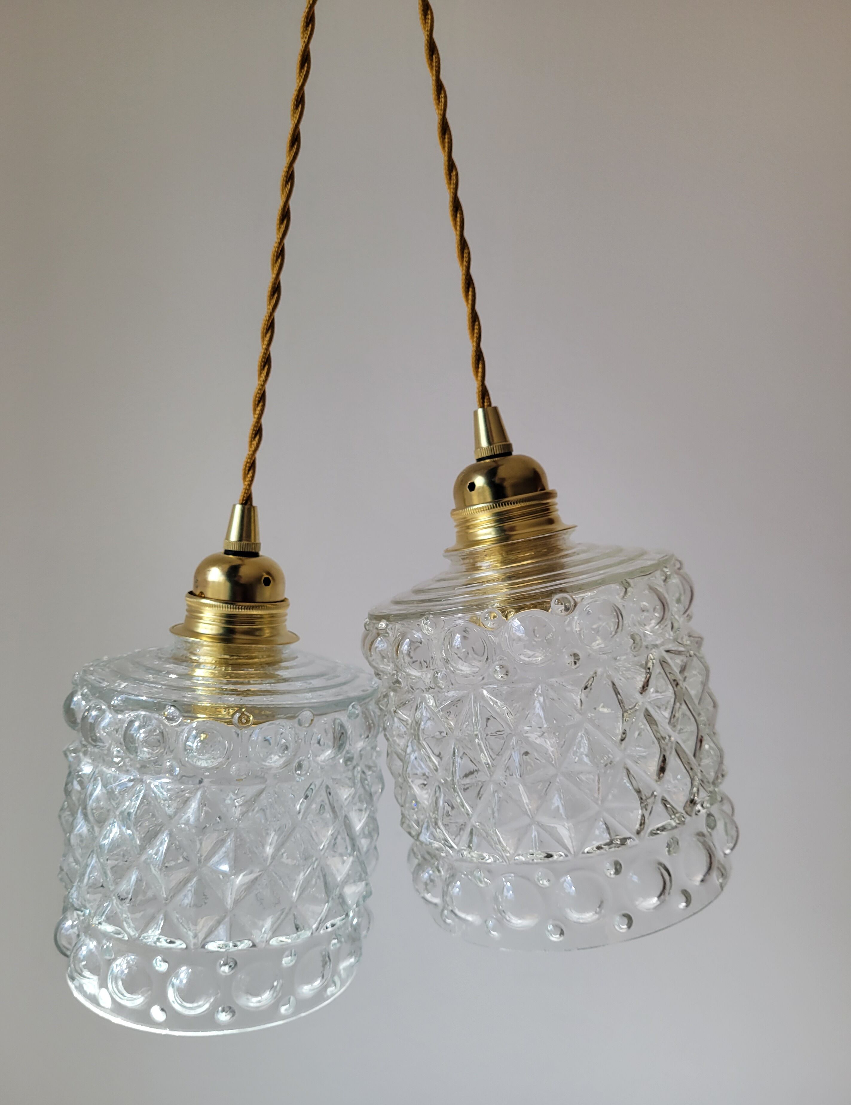 Duo of molded glass pendant lights