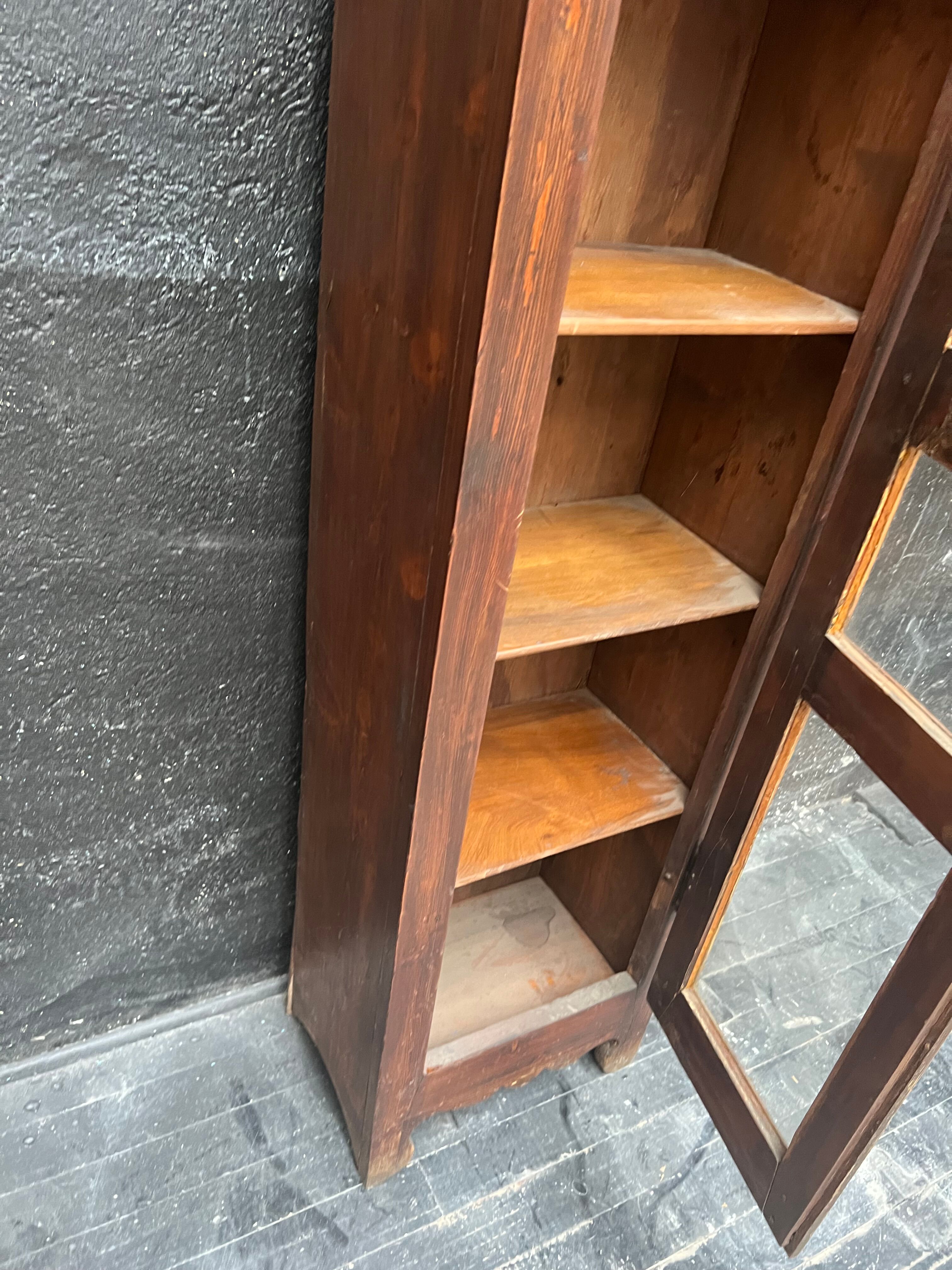 Old narrow wooden showcase.