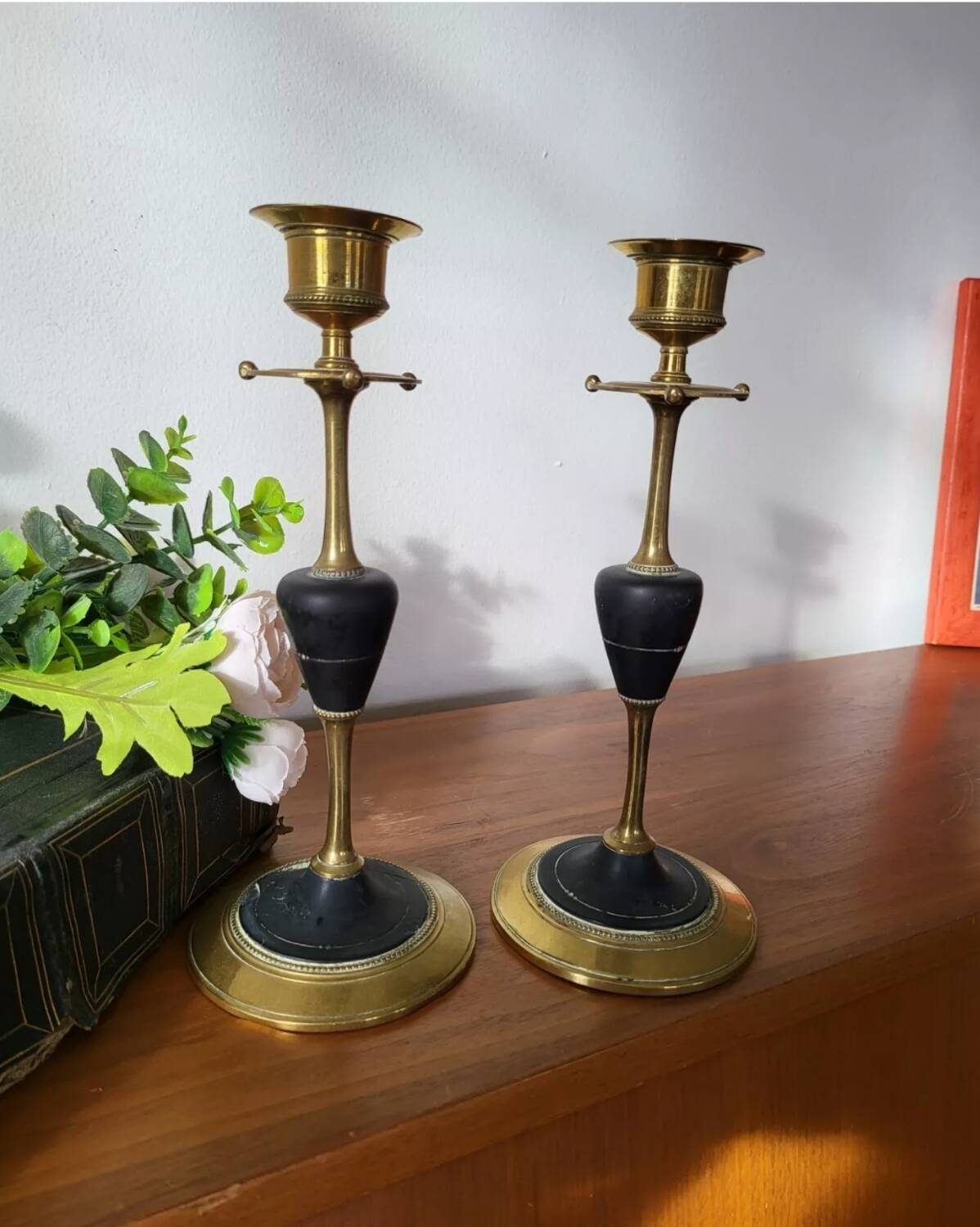 Pair of brass and black hard stone candlesticks