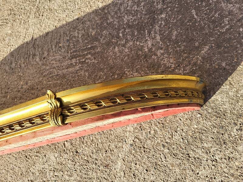 Old bed canopy in yellow copper and bronze