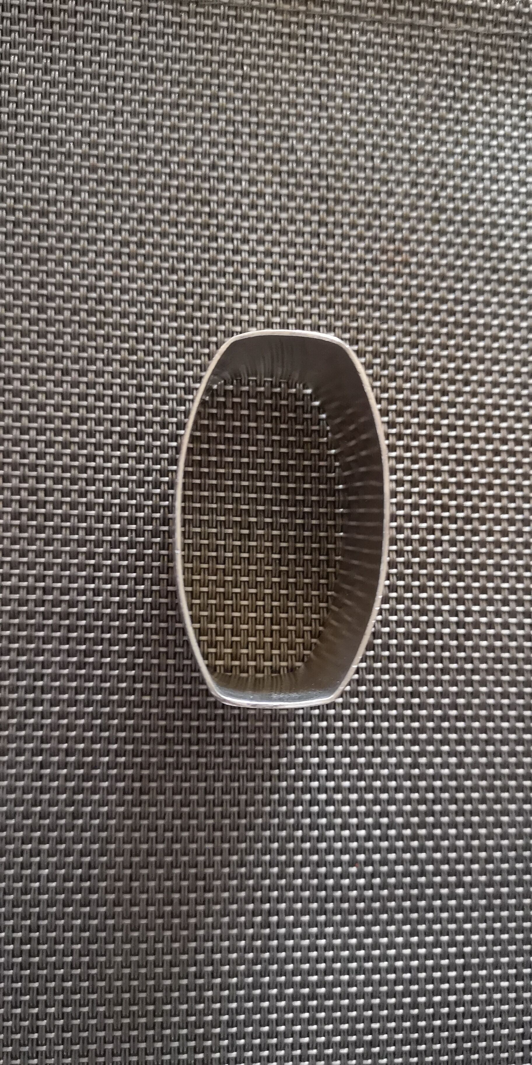 Punched silver metal towel round
