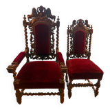 Pair of Louis XIII style armchairs in carved wood