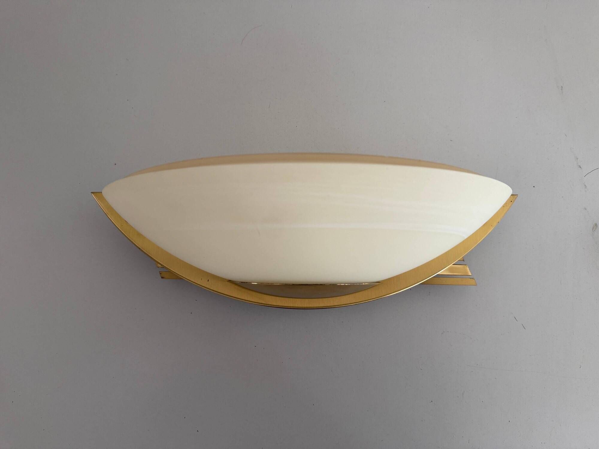 Pair of brass and glass wall lights from the Spage era, 1980, Germany.