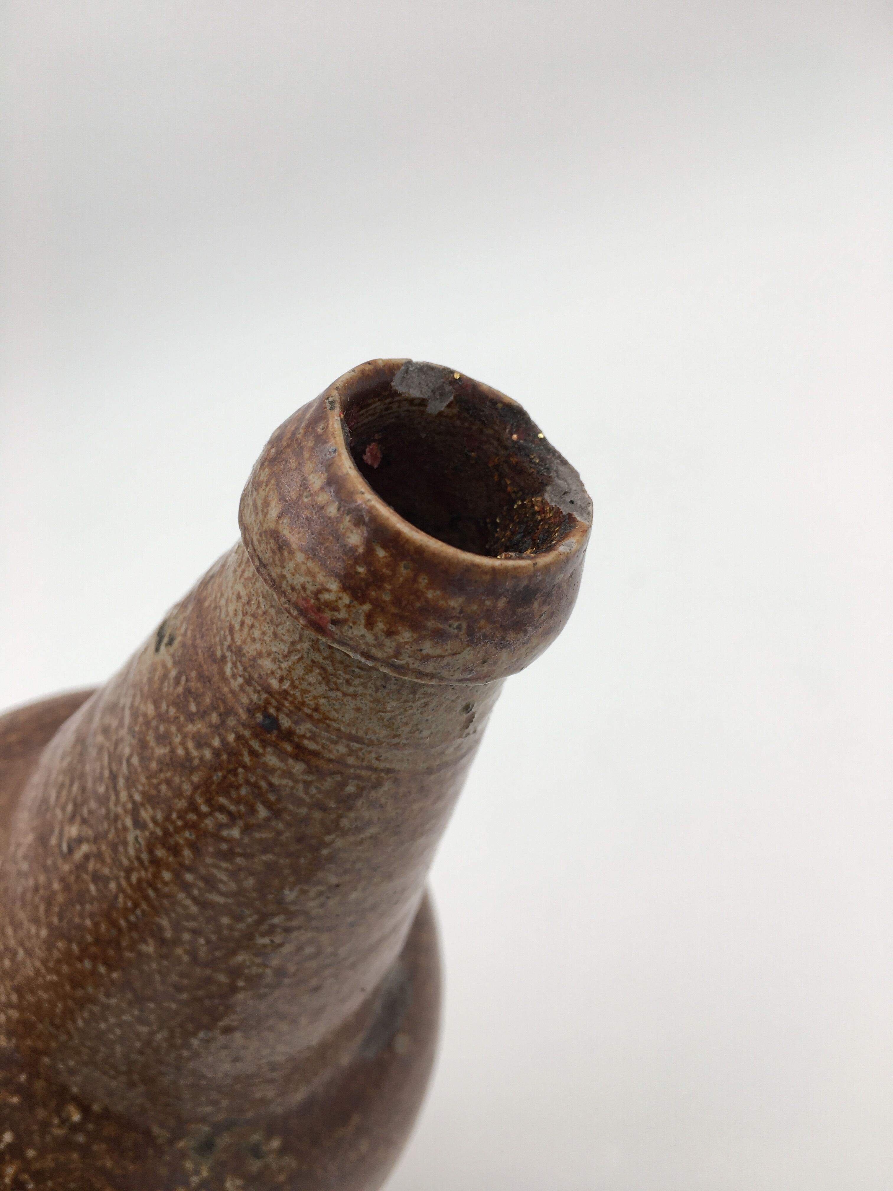 Old glazed terracotta bottle, early 20th century