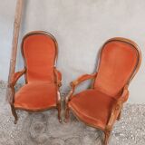 Two Voltaire type armchairs, in orange velvet