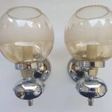 Pair of chrome metal wall lights with vintage sandblasted glass globes