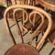 Six patinated bistro chairs