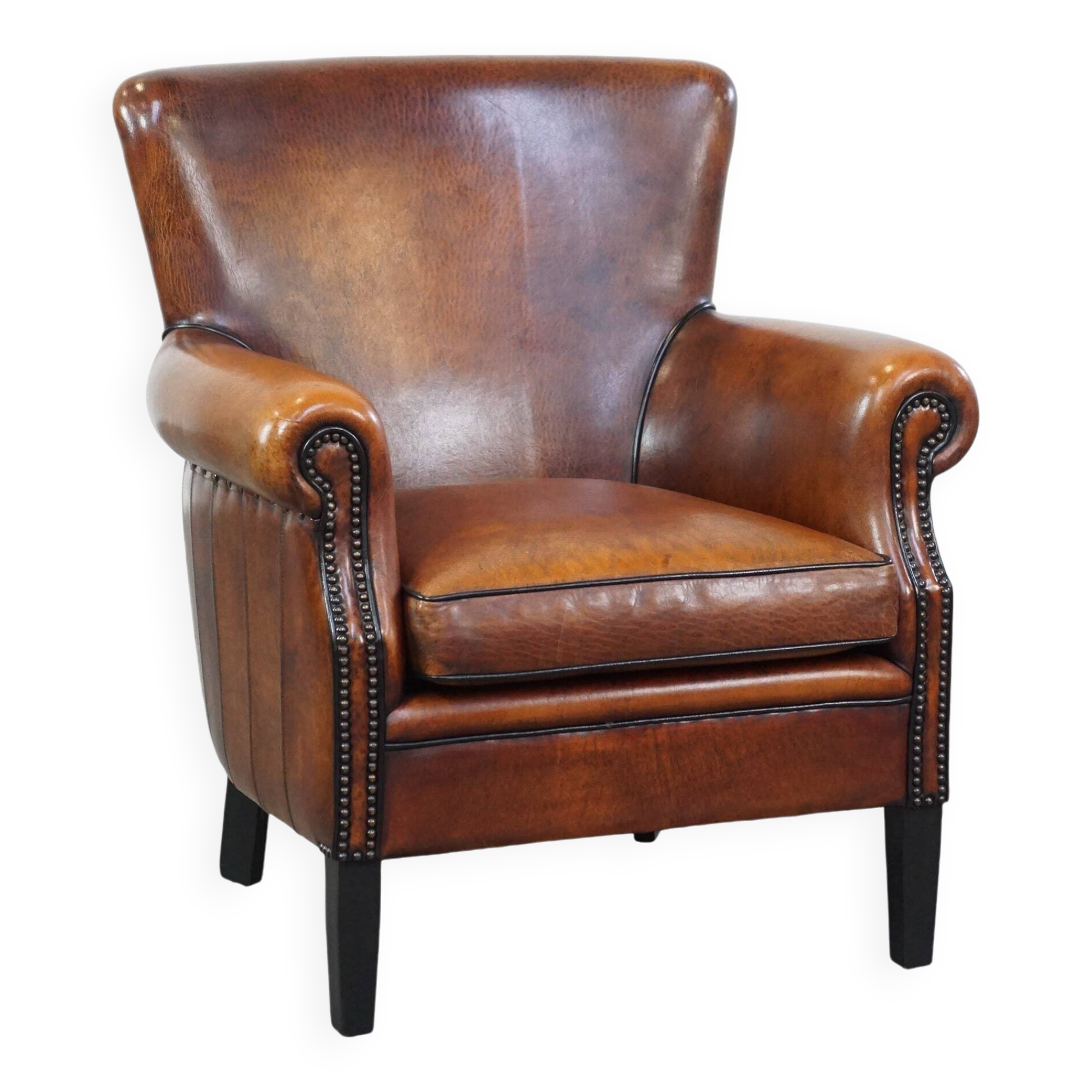 Sheepskin armchair/lounge chair finished with decorative nailheads