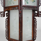 Asian wooden lantern carved with dragons and painted glass panels