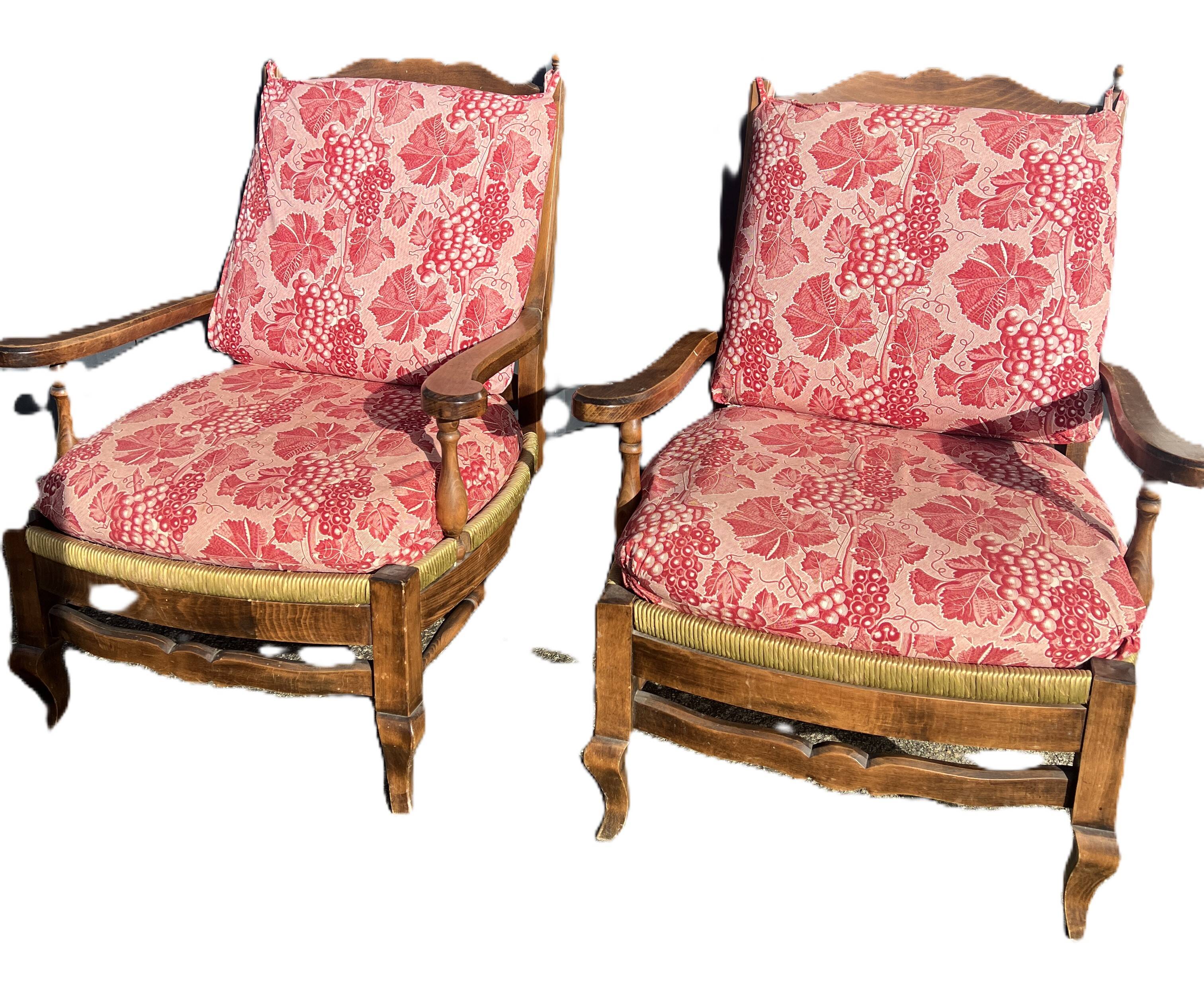 pair of rustic wood and fabric armchairs