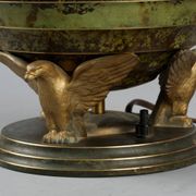 Art Deco table lamp in patinated bronze with eagles holding a globe, France 1940.