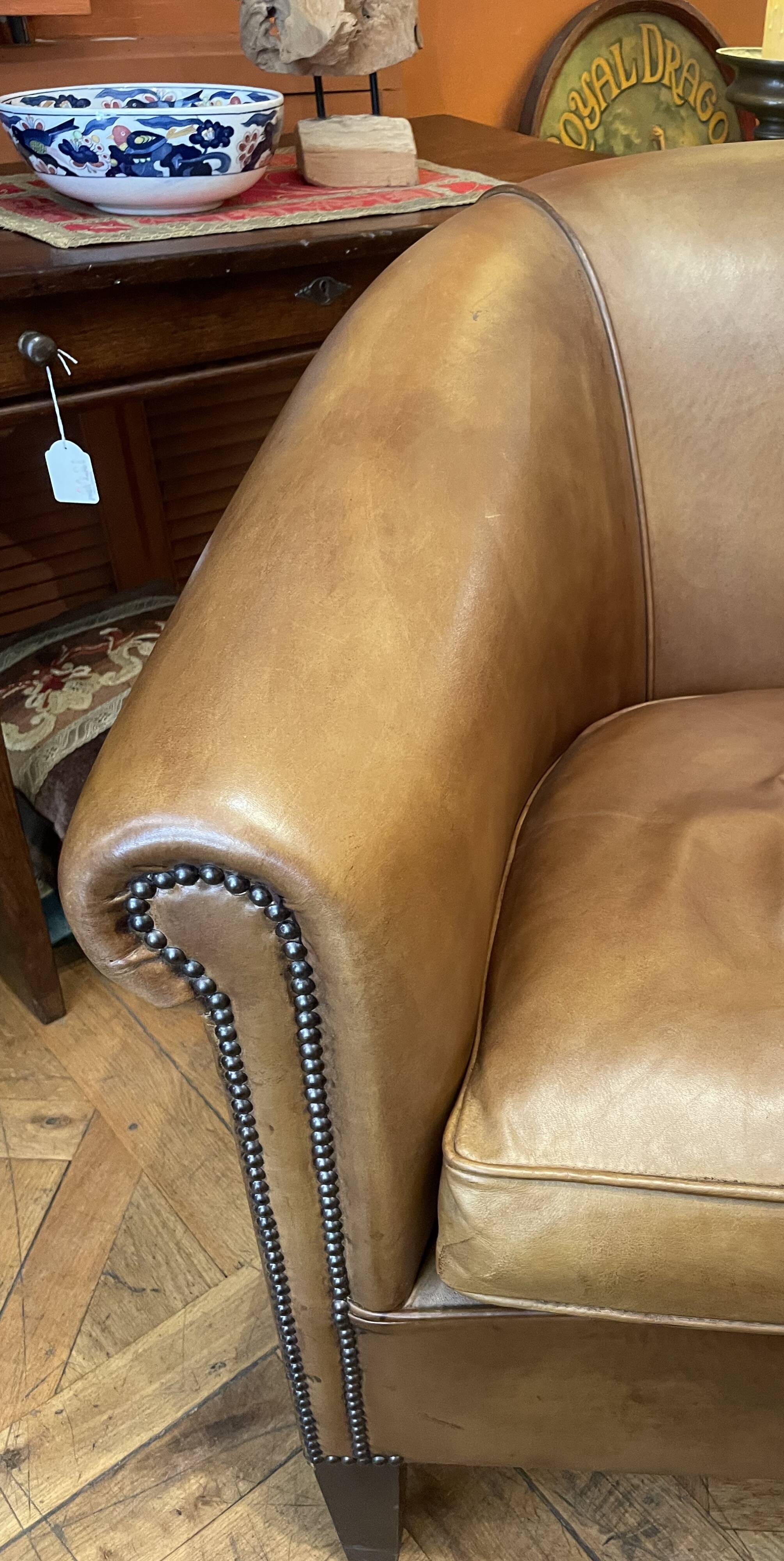 pair of camel leather club armchairs