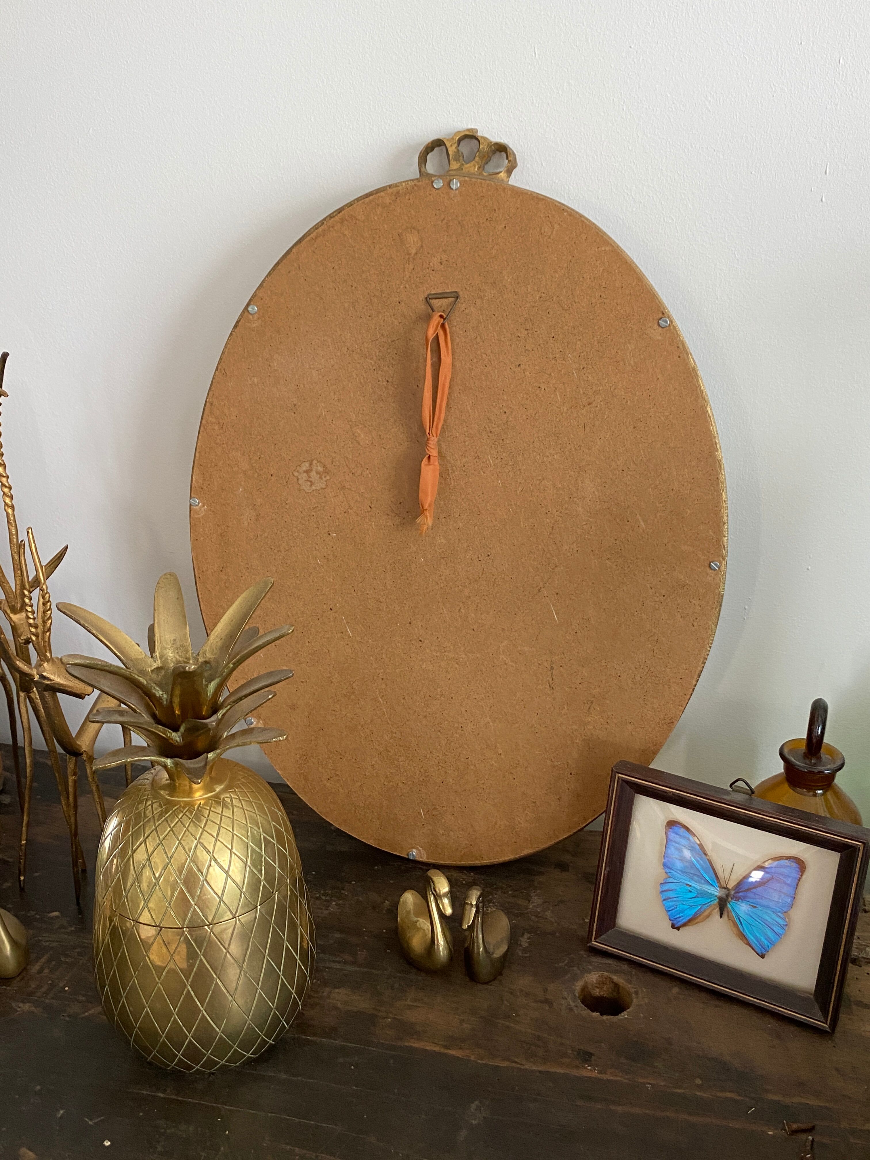 Golden oval mirror 32x44cm