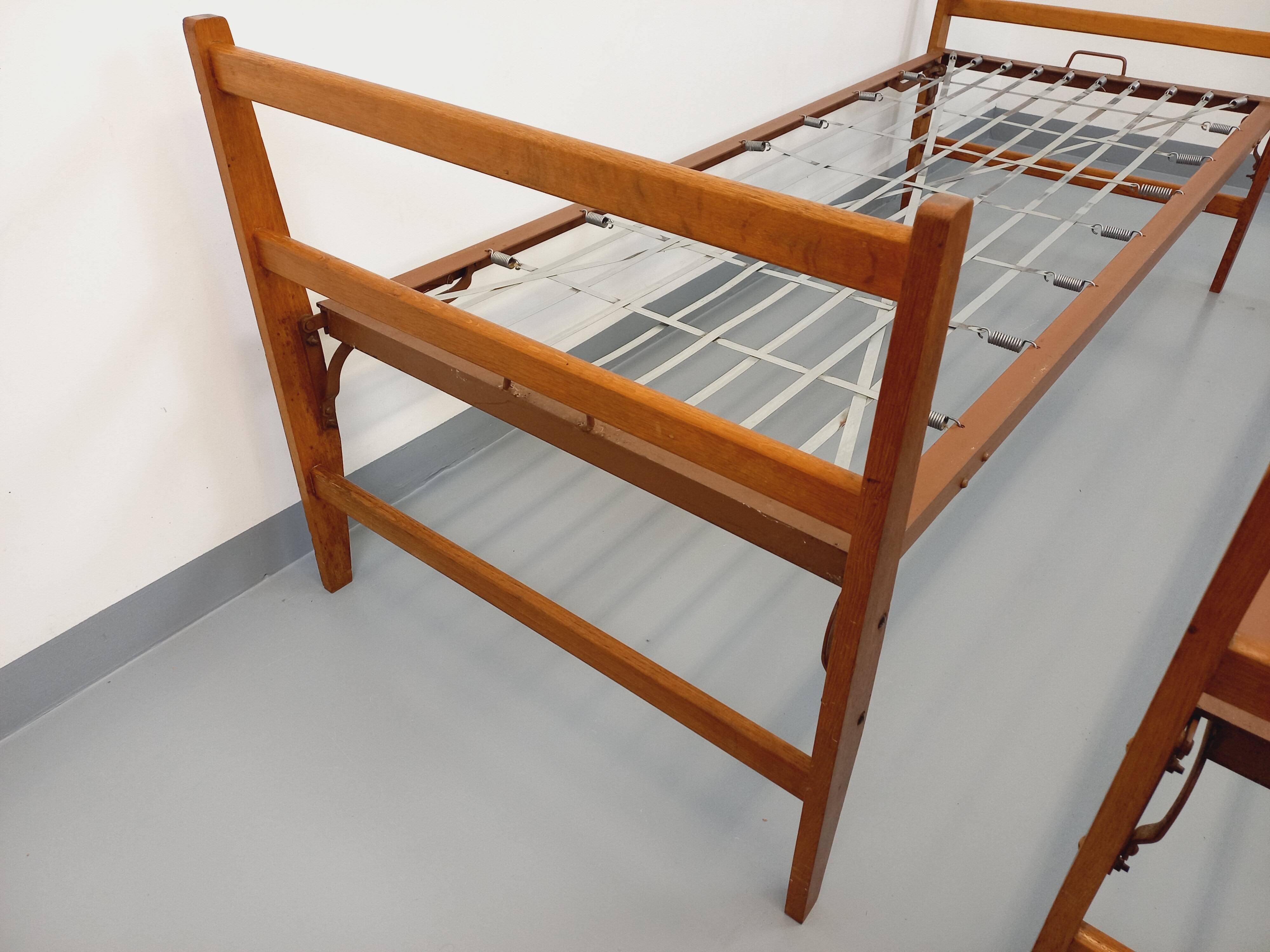Pair of vintage stackable daybeds in oak wood and metal from the 60s