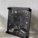 Cast iron trivet with sunflower decor