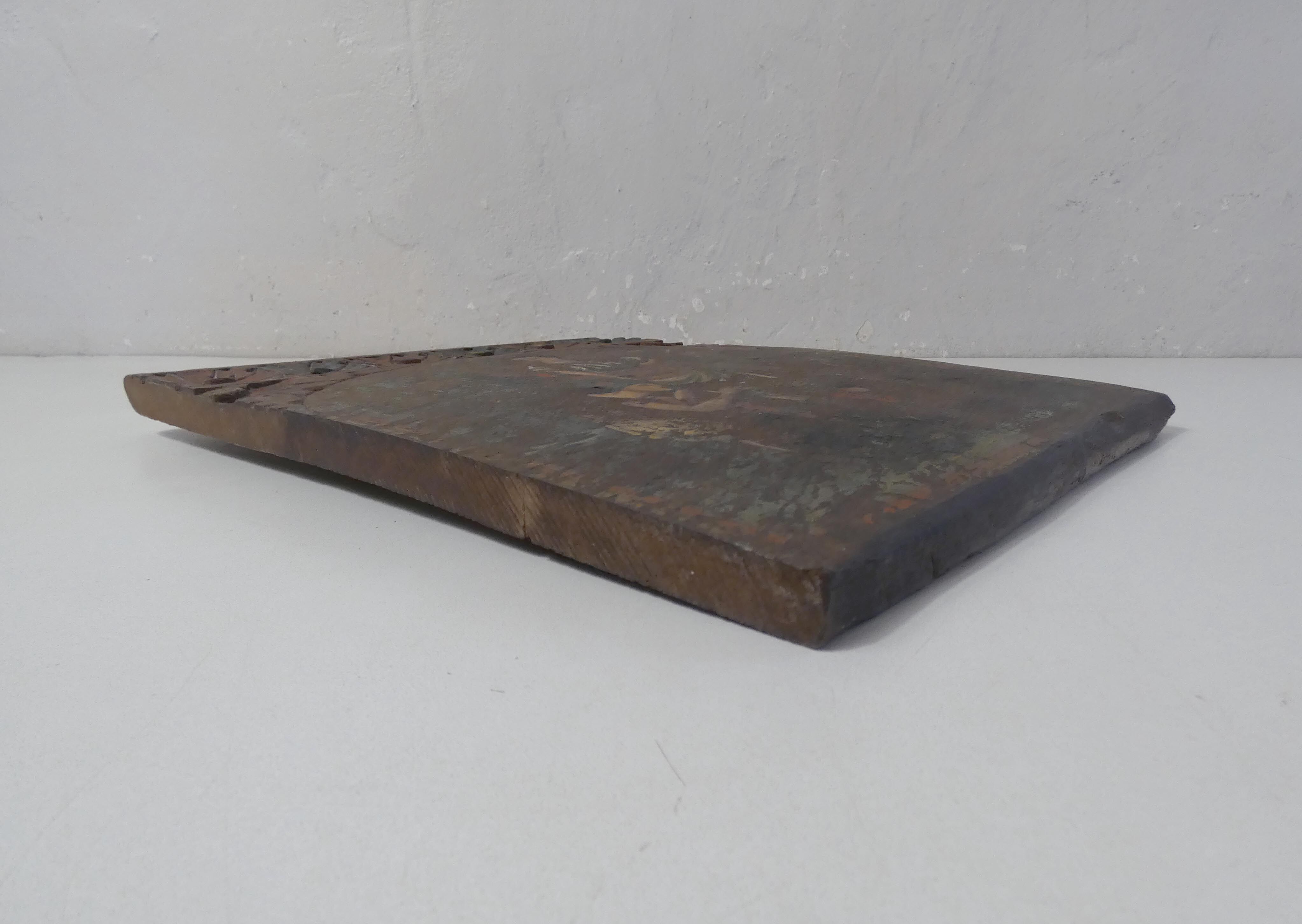 Painting on carved wood panel