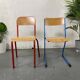 Set of 2 mismatched industrial school chairs