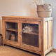 Old wooden buffet with a glass front in raw wood