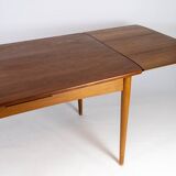 Dining table in teak with extentions and legs in oak, of danish design from the 1960s.