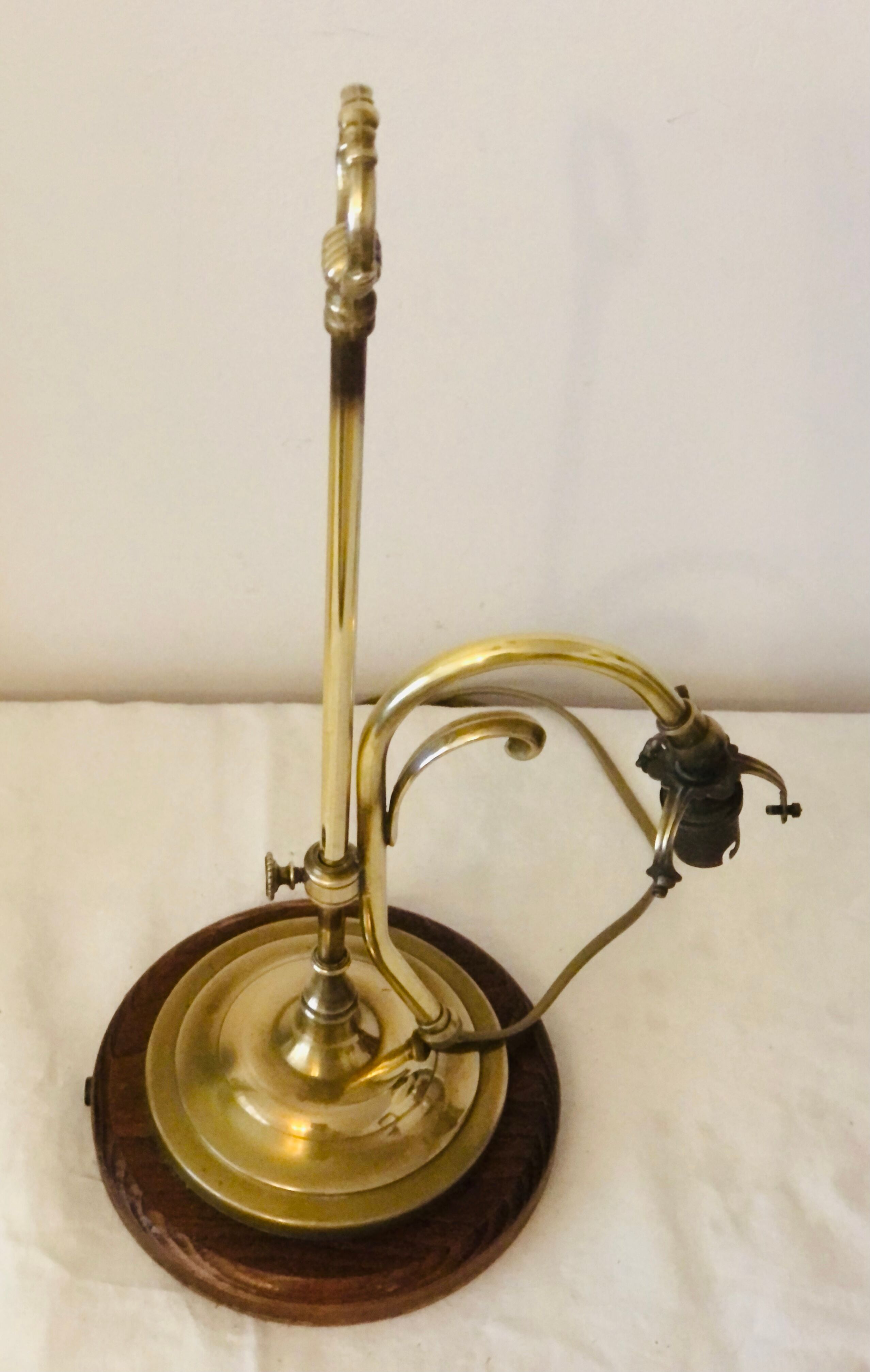 Old lamp adjustable on foot tulip golden brass.