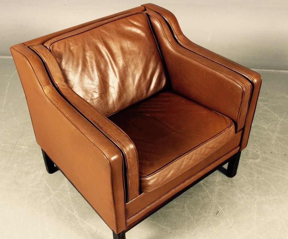 Armchair design Scandinavian brown leather.